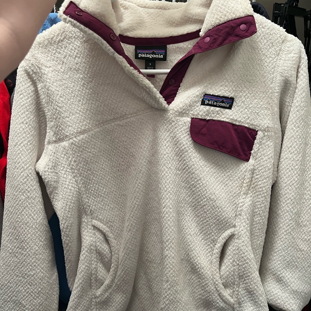 Women’s Patagonia Fleece Pullover size small, purple and white is the color.